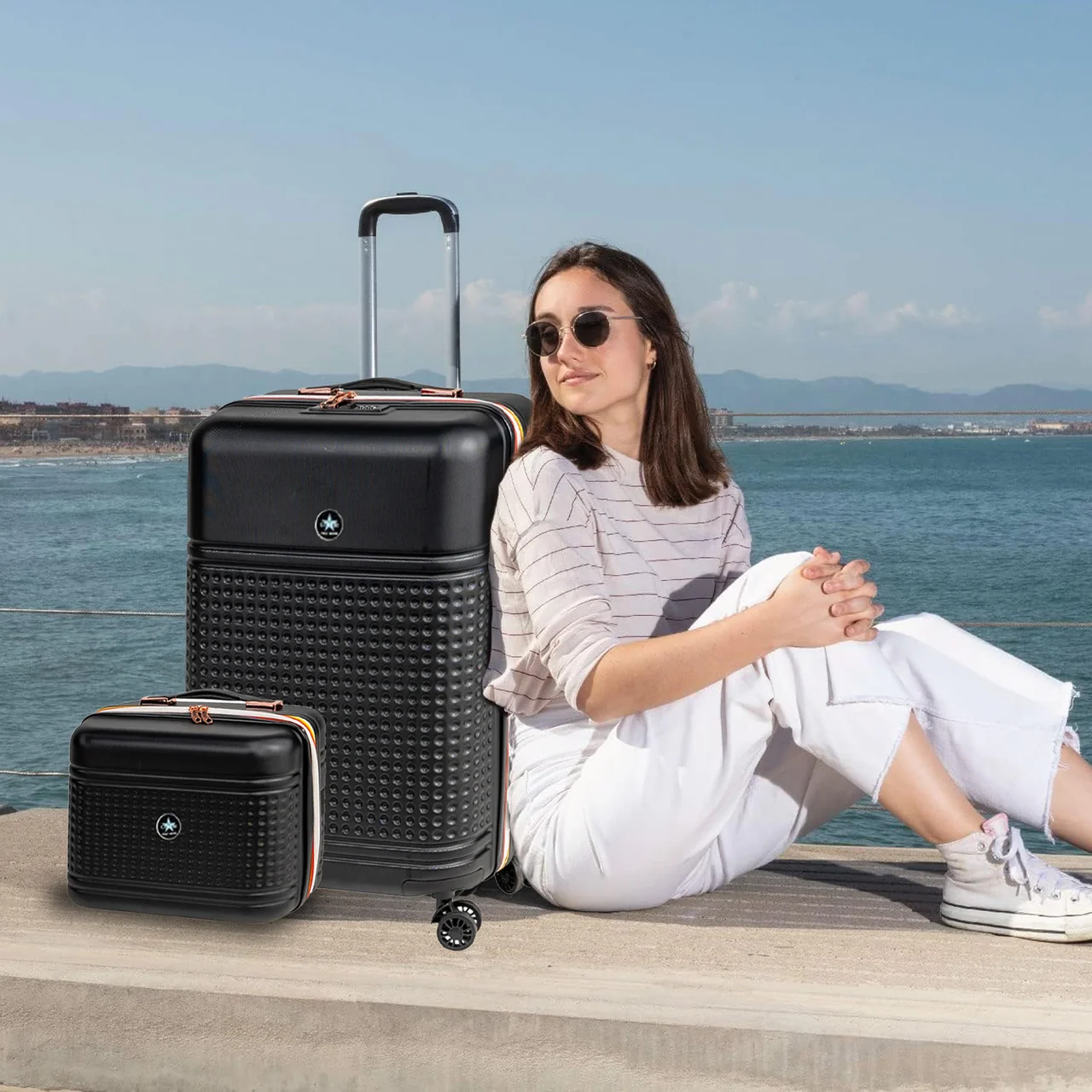 Set coordinato di trolley rigidi con beauty case